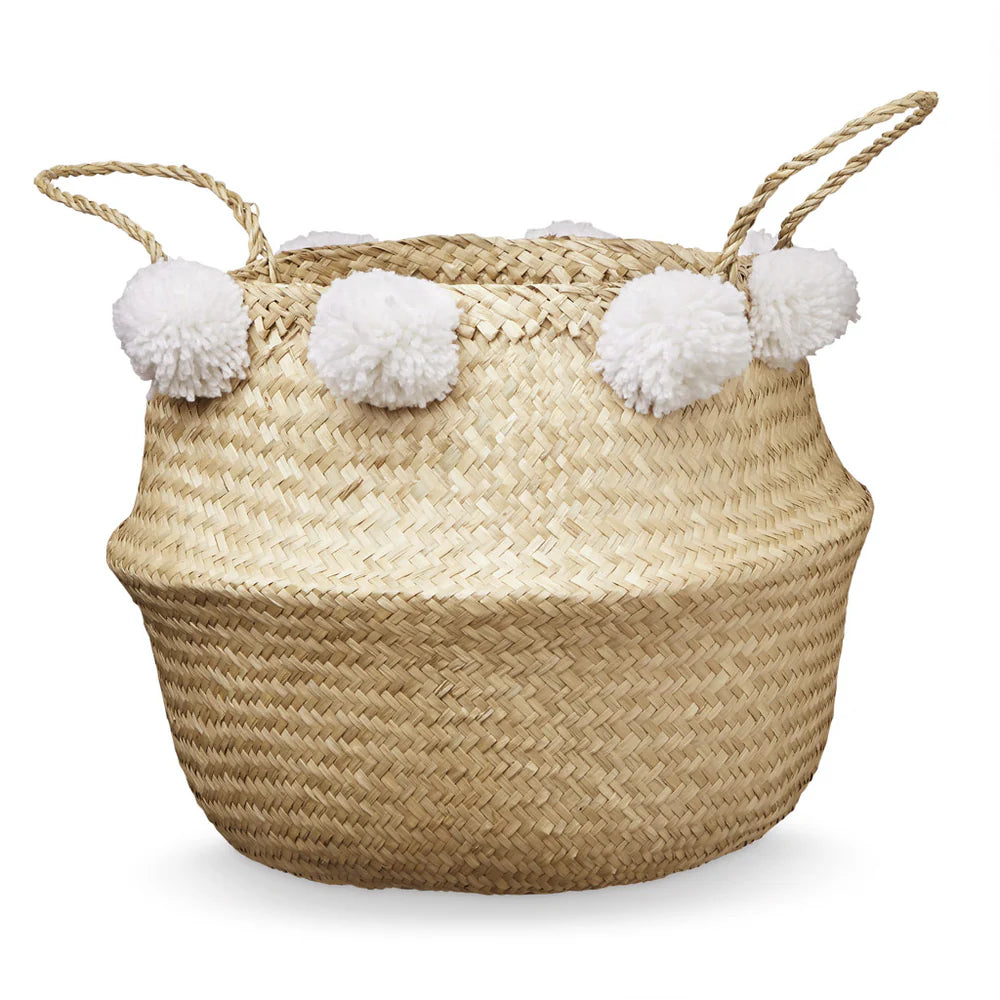 Cesta de almacenamiento con pompones.