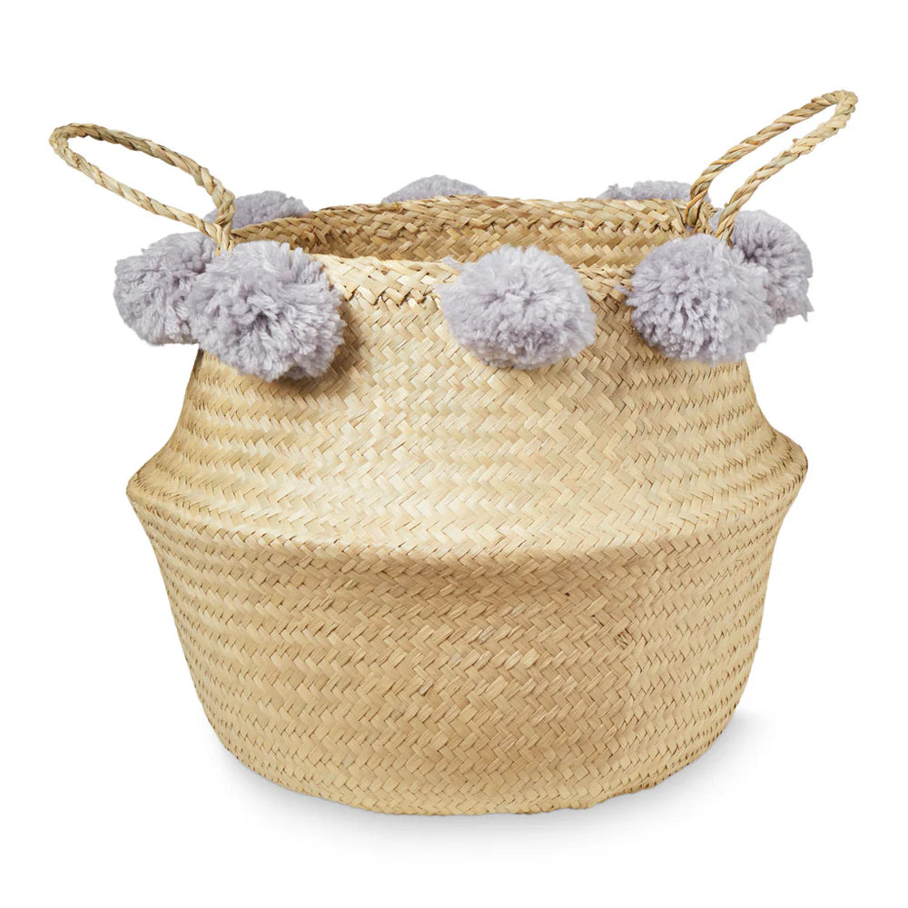 Cesta de almacenamiento con pompones.