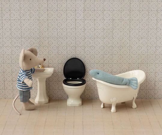 Miniature bathroom, suitcase house, and mouse house.
