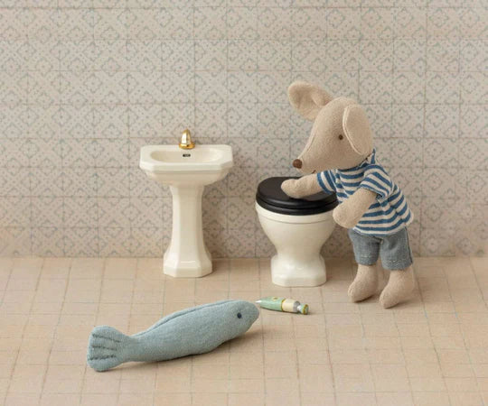 Miniature bathroom, suitcase house, and mouse house.